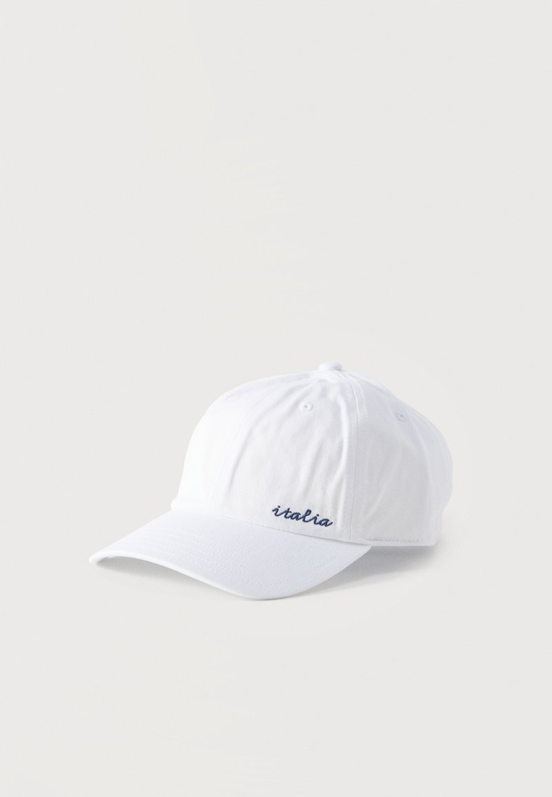 Valge kurgimüts kaardus visorkuul ja ees vasakul paneelil väikses merevaiguhallis kirjeldatud "italia" kirjaga.