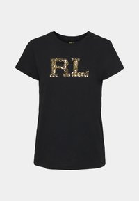 Camiseta negra de algodón con mangas cortas y cuello redondo, adornada con un logo "RL" de lentejuelas doradas en el centro.
