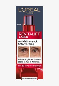 Opakowanie produktu L'Oréal Paris Revitalift Laser cechuje się ciemnym tłem, wyraźnie widoczną czerwoną butelką i dużym białym tekstem.