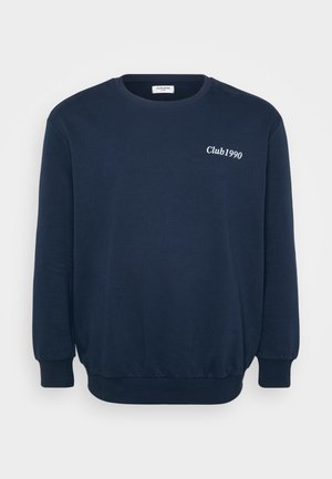 Navy blue sweatshirt with long sleeves, round neck, and ribbed cuffs. Features "Club1990" logo in white embroidery on the chest.