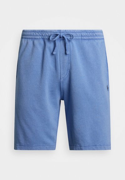 Blå bomullsshorts med elastisk midje, justerbar snor og sidelommer. Har en liten logo på venstre bein.