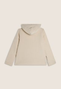 Felpa cappuccio in corduroy beige con una superficie testurizzata, cappuccio centrale e maniche lunghe. Presenta una tasca a marsupio frontale e fessure laterali.