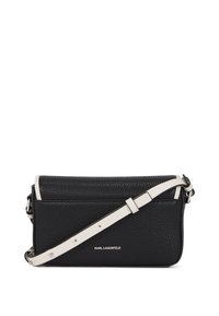 Black textured leather crossbody bag with white accents, adjustable strap, and silver-tone hardware. Features logo on the front.
