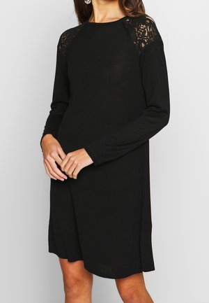 Stickad klänning - black