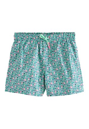 Turquoise swim shorts with pink and white boat pattern, elastic waistband, and mint green drawstring tie.