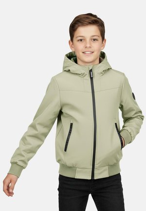 Lichtgroene jas met capuchon, zwarte accenten, een rits aan de voorkant en zijzakken. De stof lijkt glad te zijn met elastische manchetten en tailleband.