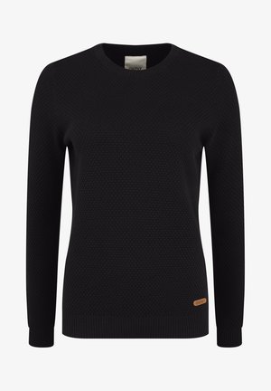 Pull en tricot noir avec une texture en nid d'abeille, col rond, manches longues, poignets côtelés et une petite étiquette de marque orange sur le côté.