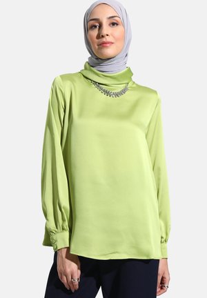 Green satin blouse with a high collar, long puff sleeves, and a jeweled neckline detail. Smooth texture and relaxed fit.