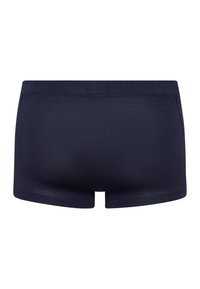 Tummansininen puuvillasekoitteinen bokserihousu, jossa on saumaton vyötärö. Kankaalla on sileä pinta ja istuva muotoilu, ja se on lyhyellä lahkeella.