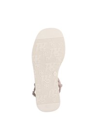 Světlé béžové sandálové podrážky s texturovaným designem, který má drážkování pro zpevnění, hladkou špičku a celkový zaoblený tvar.
