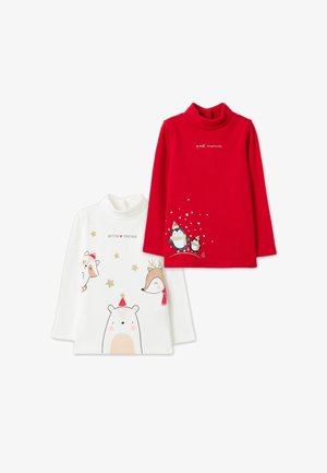 Dos camisetas de cuello alto de manga larga: una blanca con estampados de animales y estrellas doradas; una roja con pingüinos y el texto "momentos especiales".