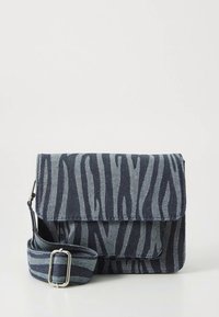 Zebra-patterned crossbody bag in navy and gray fabric, with a flap closure and an adjustable strap featuring matching striped accents.