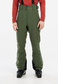 Pantalons de neige verts avec des bretelles ajustables, une taille haute et des accents noirs au niveau des poignets. Fabriqués en matériau durable et résistant à l'eau.