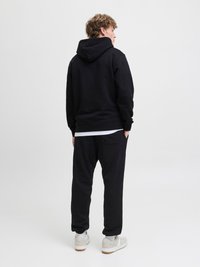 Jack & Jones JPSTKANE SOHO - Tracksuit bottoms - black