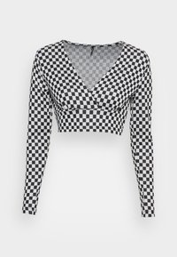 Top cropped de manga longa em padrão xadrez preto e branco, com um decote em V profundo e um design ajustado. Feito de um tecido macio e elástico.