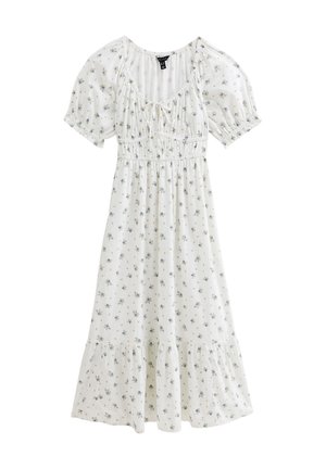 Robe blanche ornée de petits motifs floraux bleus, avec des manches courtes bouffantes, un corsage froncé et un ourlet en plusieurs niveaux. Fabriquée dans un tissu léger.