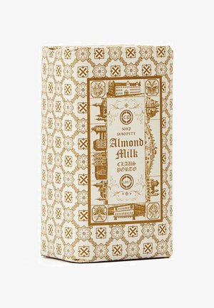 Almond Milk soap in a rectangular brown and cream patterned box featuring historical building illustrations and ornate borders.