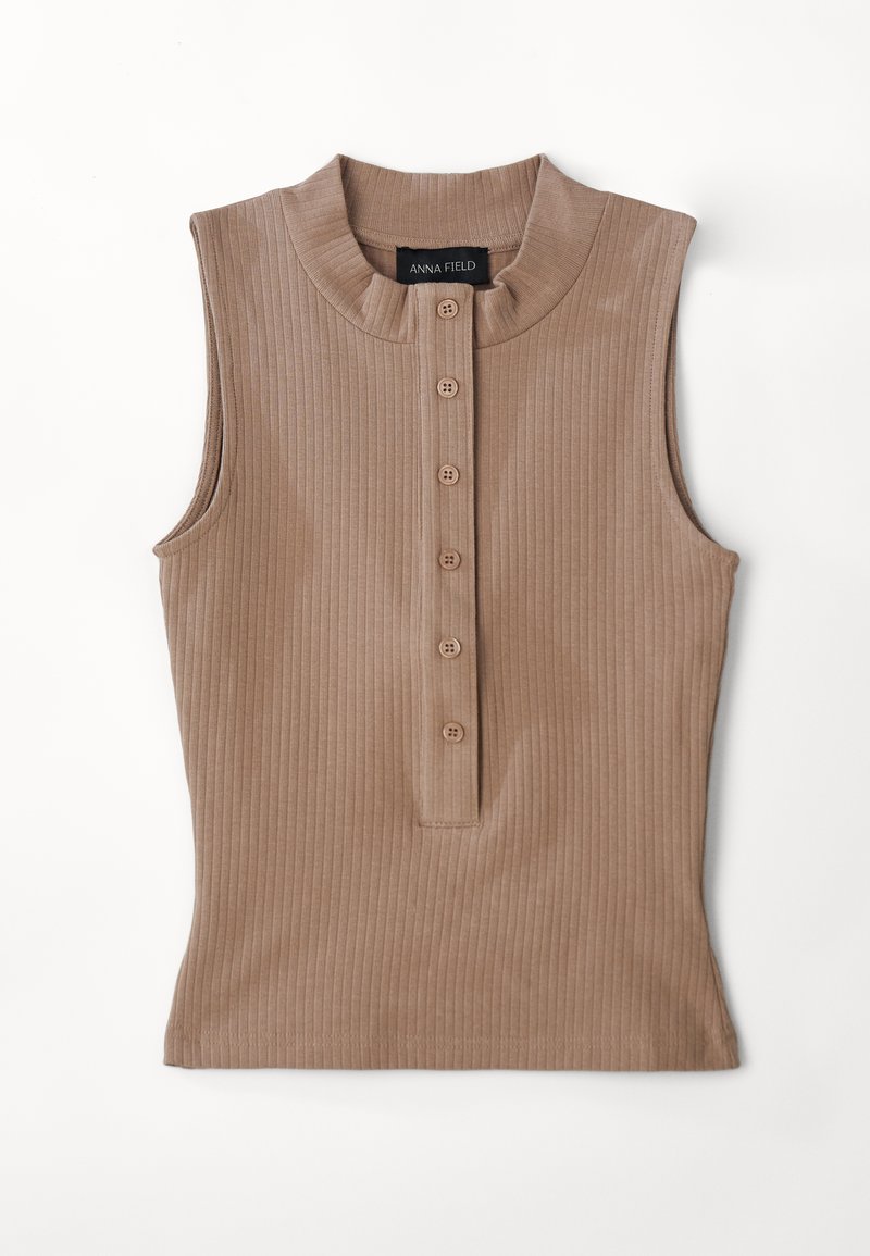 Tan sleeveless top made of ribbed fabric. Features a high collar and a button placket with five brown buttons. Smooth texture.