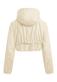 Kremowa krótka kurtka z długimi rękawami i przymocowanym kapturem, pokazana od tyłu na białym tle.