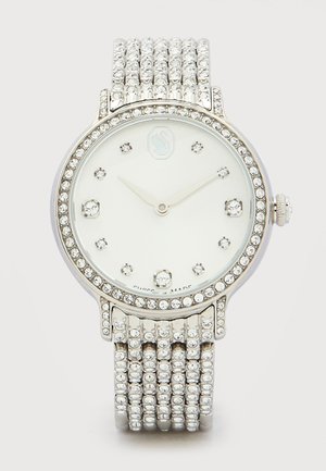 Silver wristwatch with crystal-studded bezel, band, and hour markers, white dial, and simple silver hour and minute hands.