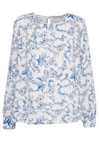 Blusa bianca con maniche lunghe caratterizzata da un motivo floreale blu e viti, con un piccolo dettaglio a apertura a chiave sul collo.