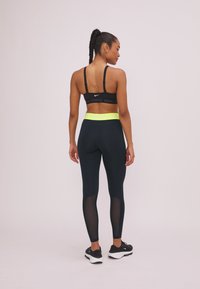 Nike Performance Tights - black/yellow