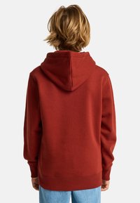 Felpa con cappuccio bordeaux dal fitting rilassato, con polsini e orlo a coste, e un tessuto testurizzato, vista da dietro.