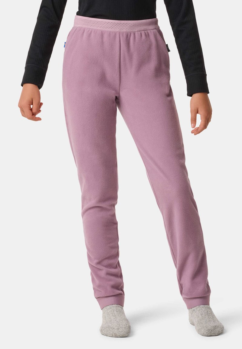 Pantaloni jogger in pile viola chiaro con una texture morbida, design affusolato e vita elastica. Presentano polsini alle caviglie e tasche laterali.