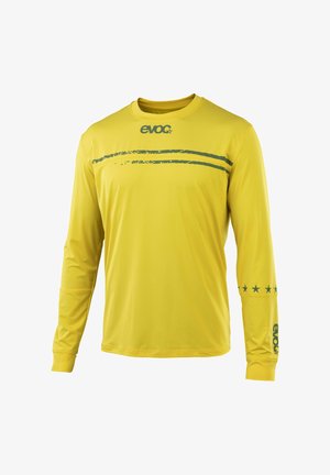 Yellow long-sleeve shirt with dark green "evoc" logo on chest and sleeve, two horizontal green stripes across upper chest, and five stars on right arm.
