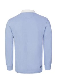 Long-sleeve polo shirt in light blue with a white collar. Soft fabric, embroidery detail near the hem, and ribbed cuffs. Simple design.
