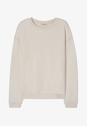 Sweatshirt od krem boje s rundastim izrezom, dugim rukavima i rebrastim manžetama. Mekana tekstura i opušteni kroj. Nema vidljivih uzoraka.
