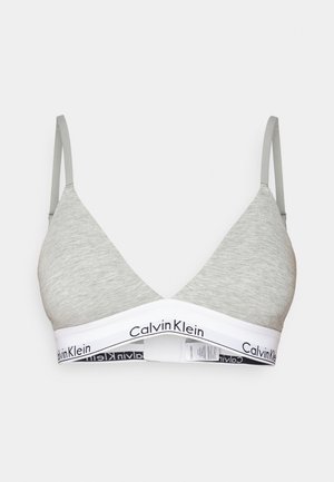 Grijze katoenen mix driehoek bralette met dunne bandjes en een witte band met "Calvin Klein" in zwart gedrukt. Zachte textuur, casual design.