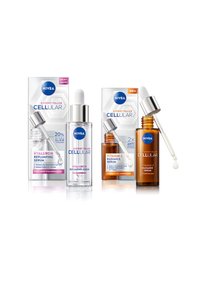 Two serum bottles with droppers, one clear with a silver cap labeled "Hyaluron Replumping" and one amber labeled "Vitamin C Radiance."