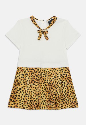 White short-sleeve dress with a leopard print skirt and a leopard-patterned collar, featuring a bow detail at the neckline.