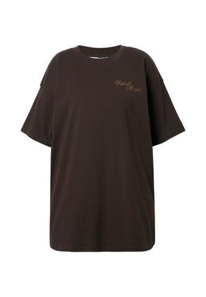 Bruine oversized t-shirt van katoen. Heeft een ronde hals en korte mouwen met "Untold Stories" geborduurd in een lichtere kleur.