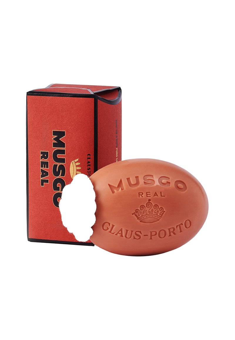 Ovaler orangefarbener Seife mit geprägt eingeprägtem Text "MUSGO REAL GLAUS-PORTO." Begleitet von einer rechteckigen roten Box mit schwarzen Akzenten.