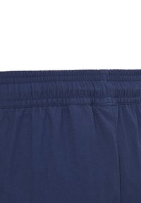 Navy blue elastic waistband, features gathered stitching. Soft, lightweight fabric with smooth texture, designed for comfort and ease of wear.