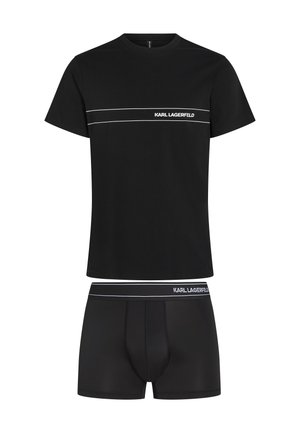 Camiseta de algodón negra de mangas cortas, con un logo blanco "KARL LAGERFELD" y rayas, acompañada de bóxers negros a juego.
