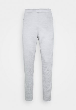 Lichtgrijze joggingbroek van textuurstof met een taps toelopende pijp, elastische tailleband en een subtiele ingebedde logo aan de zijkant.