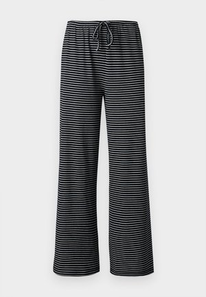 Schwarz-weiß gestreifte, weit geschnittene Hose mit elastischem Bund und vorne zu bindender Kordel.