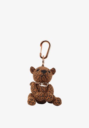 Pequeño llavero de peluche con forma de leopardo con manchas marrones y negras, ojos negros y un collar de cadena dorado unido a un mosquetón dorado.