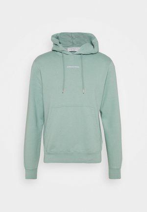 Vaaleanvihreä hupullinen collegepaita, jossa etutasku, kiristysnyörit ja pieni keskitetty teksti "SANDRO PARIS" rinnassa.