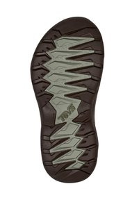 Καφέ και γκρι ανθεκτική σόλα πέδιλου με βαθιές ζιγκ-ζαγκ προεξοχές και το λογότυπο "Teva" στο κέντρο του κάτω μέρους της σόλας.