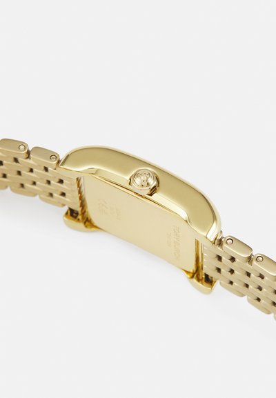 Gold-tone wristwatch with a rectangular case, metallic mesh band, textured surface, and a prominent crown. Engraved logo on the back.