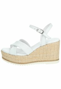 Sandali wedge bianchi con platform in juta intrecciato, dotati di fasce incrociate e di una cinghia per la caviglia regolabile. Materiale in pelle liscia.