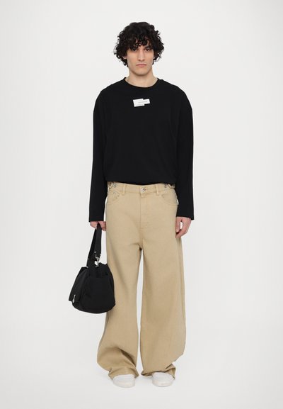 Feng Chen Wang UNISEX - Relaxed fit jeans - beige