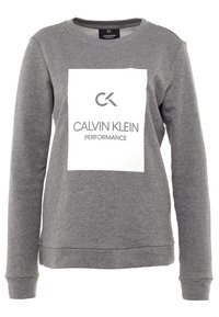 Sweat-shirt gris en mélange de coton, doté d'un col rond, de manches longues et d'un grand motif blanc avec le texte "CALVIN KLEIN PERFORMANCE".