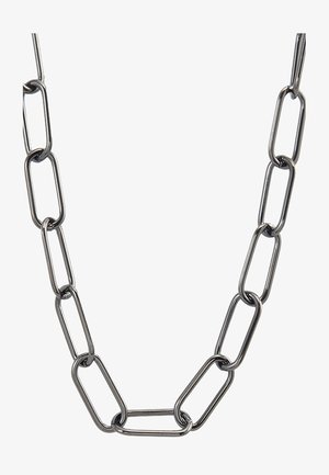 Muzieklink ketting gemaakt van zilverkleurig metaal, met verlengde ovale schakels met een gladde textuur en een uniforme afwerking.