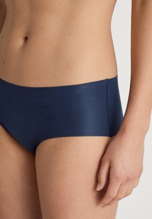 Navy blue hipster briefs made of smooth, stretchy fabric with a low-rise waistband and minimal seams for comfort.