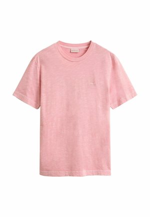 Soft pink short-sleeve crew neck t-shirt with subtle texture and small logo on the left chest, displayed on a white background.